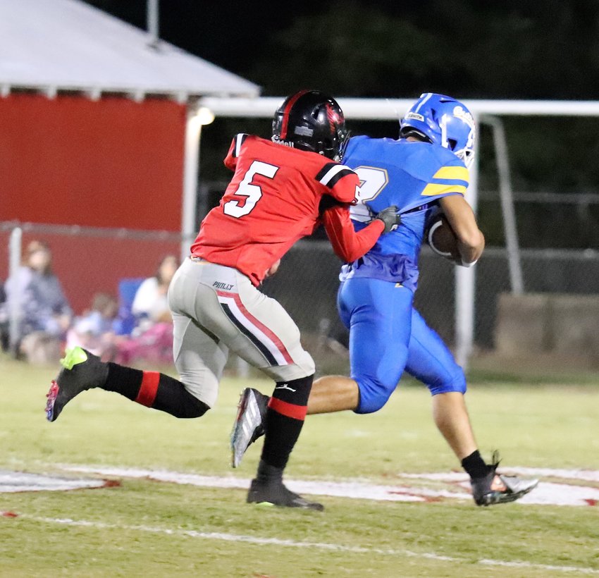 Austin Donald tries to stop a Mize player from running into the endzone for a touchdown.